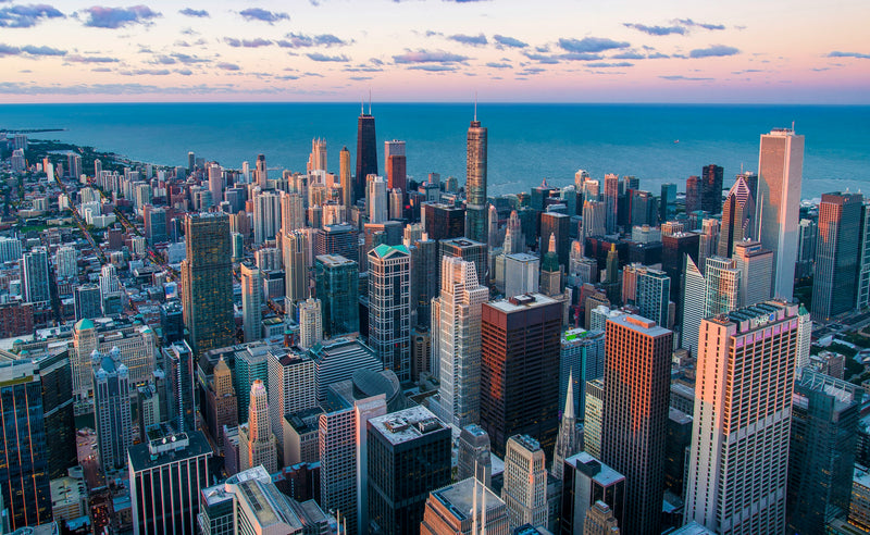 Aerial view of Chicago skyline and a sunset sky.