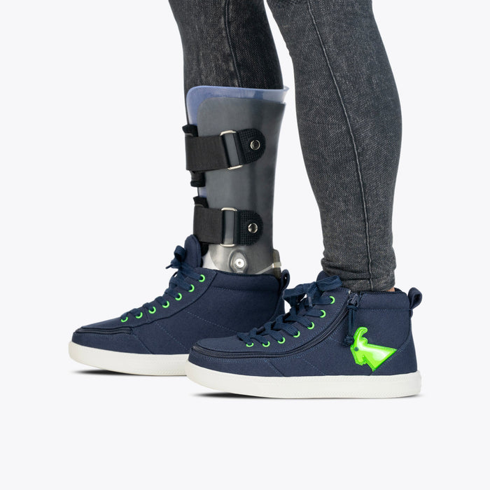 Navy/Green Light Ups BILLY Classic D|R High on model worn with charcoal leggings and grey AFO on a white background
