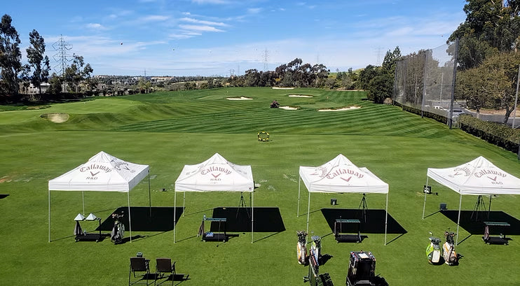Callaway's Driving range with Callaway tents and shot trackers.