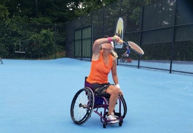A Cincinnati Tennis Foundation advanced wheelchair tennis participant getting ready to return a serve.