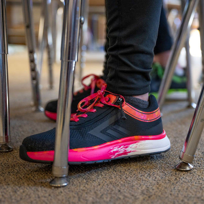 Black/Fuchsia Fire BILLY Sport Inclusion on model worn with black leggings in a classroom