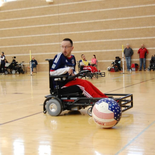 GLASA power soccer athlete getting ready to push the soccer ball.