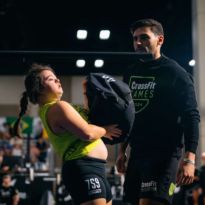 Equip Products Strongman Throw Bag being thrown in competition by an athlete with Down Syndrome.