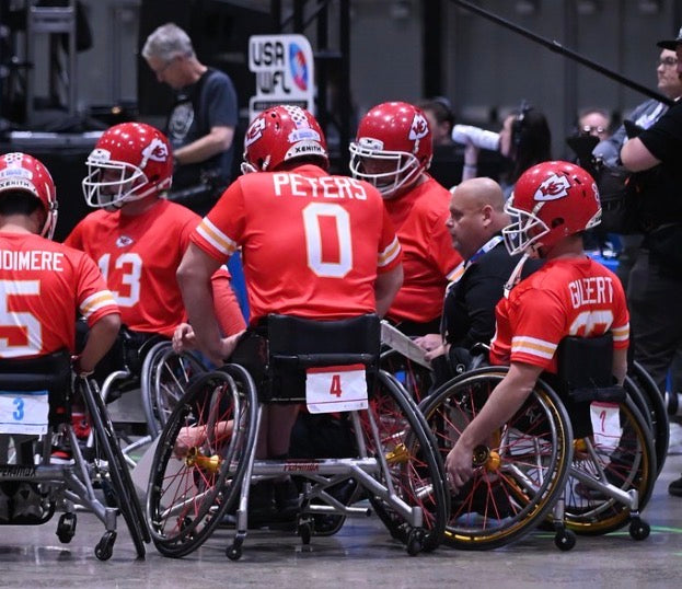 MAS Kansas City Chiefs in a huddle with the coach during the USAWFL 2025 Championships