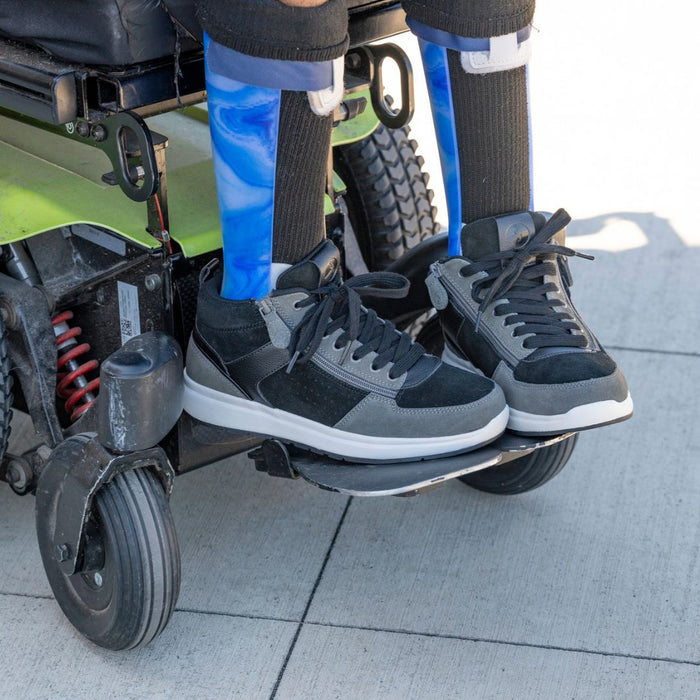 Men's Black/Charcoal/Black BILLY Comfort DZ High on model with blue AFO in a power wheelchair outdoors