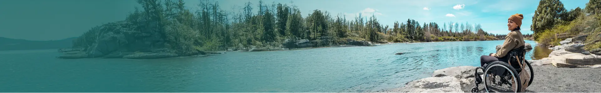 A wheel chair user viewing a lake