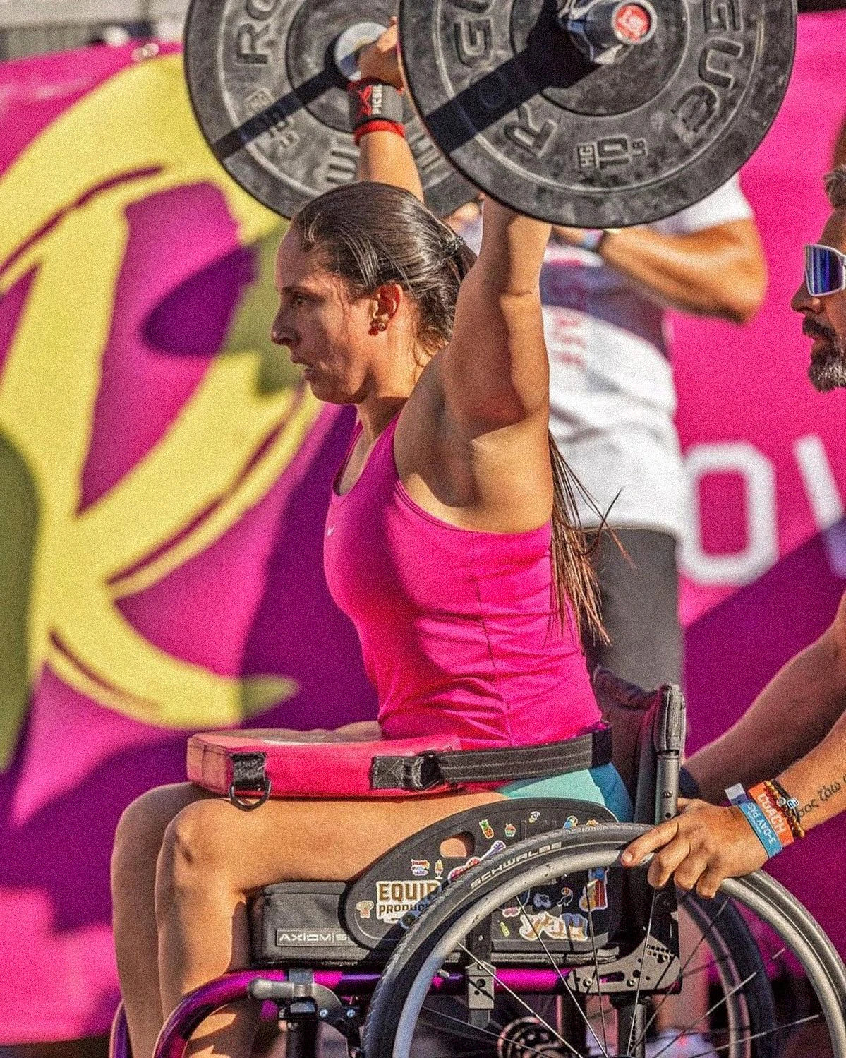 A CrossFit competitor lifting a barbell with 15lbs on each side as a right above knee amputee.