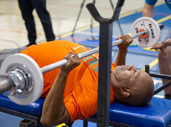 GLASA athlete performing a bench press.