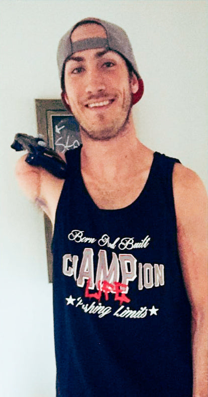 Portrait of Team Amplife® Ambassador Aaron Soetaert holding an Xbox 360 controller with his right shoulder disarticulation amputated arm while rocking his Amplife® while wearing the Born and Build chAMPion Tank Top