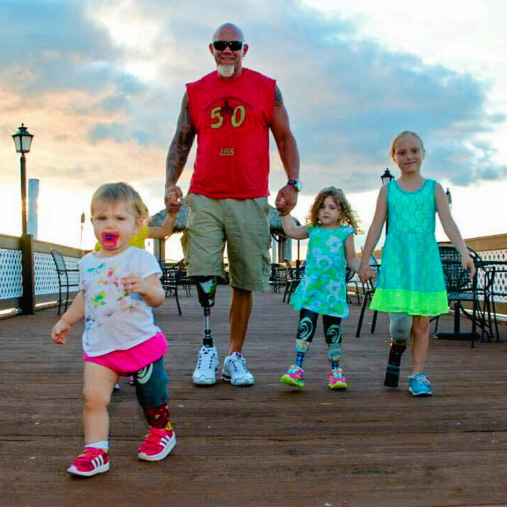 5O LEGS FOUNDER STEVE CHAMBERLAND WITH 4 GIRL AMPUTEES