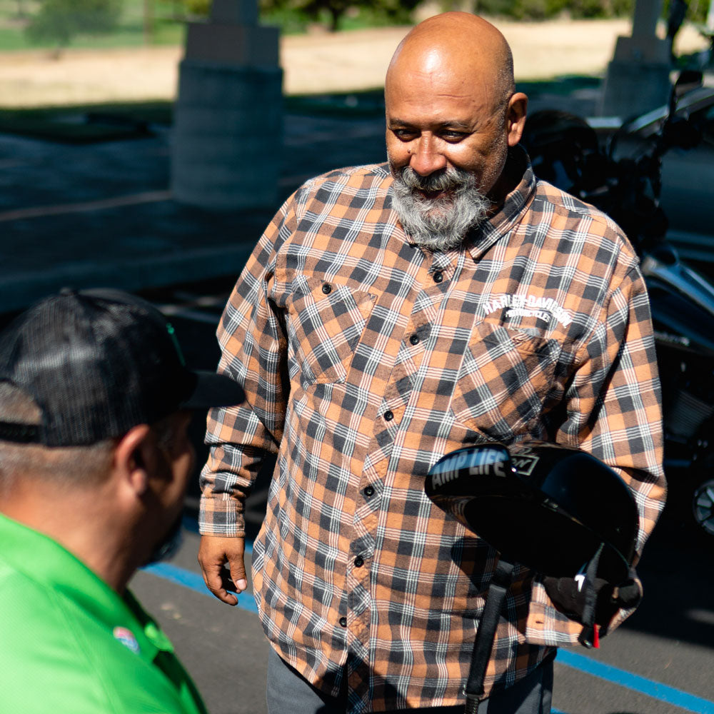TEAM AMPLIFE AMBASSADOR STEVEN HILL SHOWING AMPLIFE FOUNDER ABDUL NEVAREZ HIS AMPLIFE MOTORCYCLE HELMET
