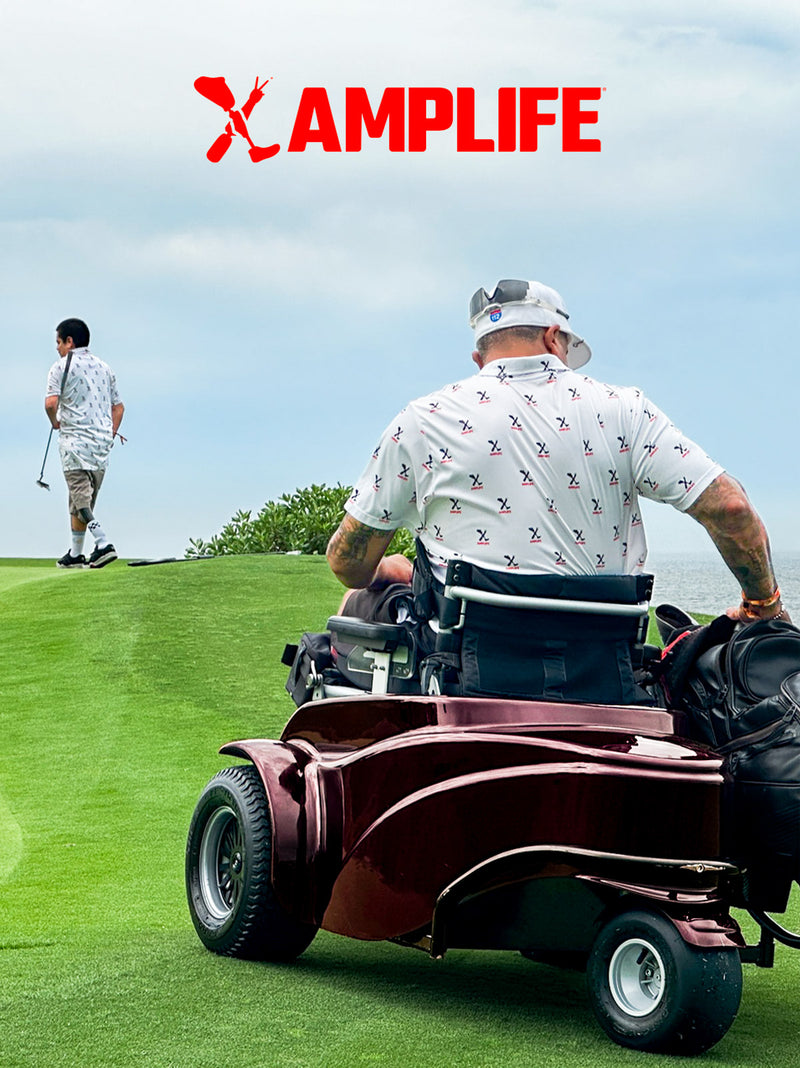 Two golfers on a coastal green wearing Amplife® Clothing getting ready to putt.