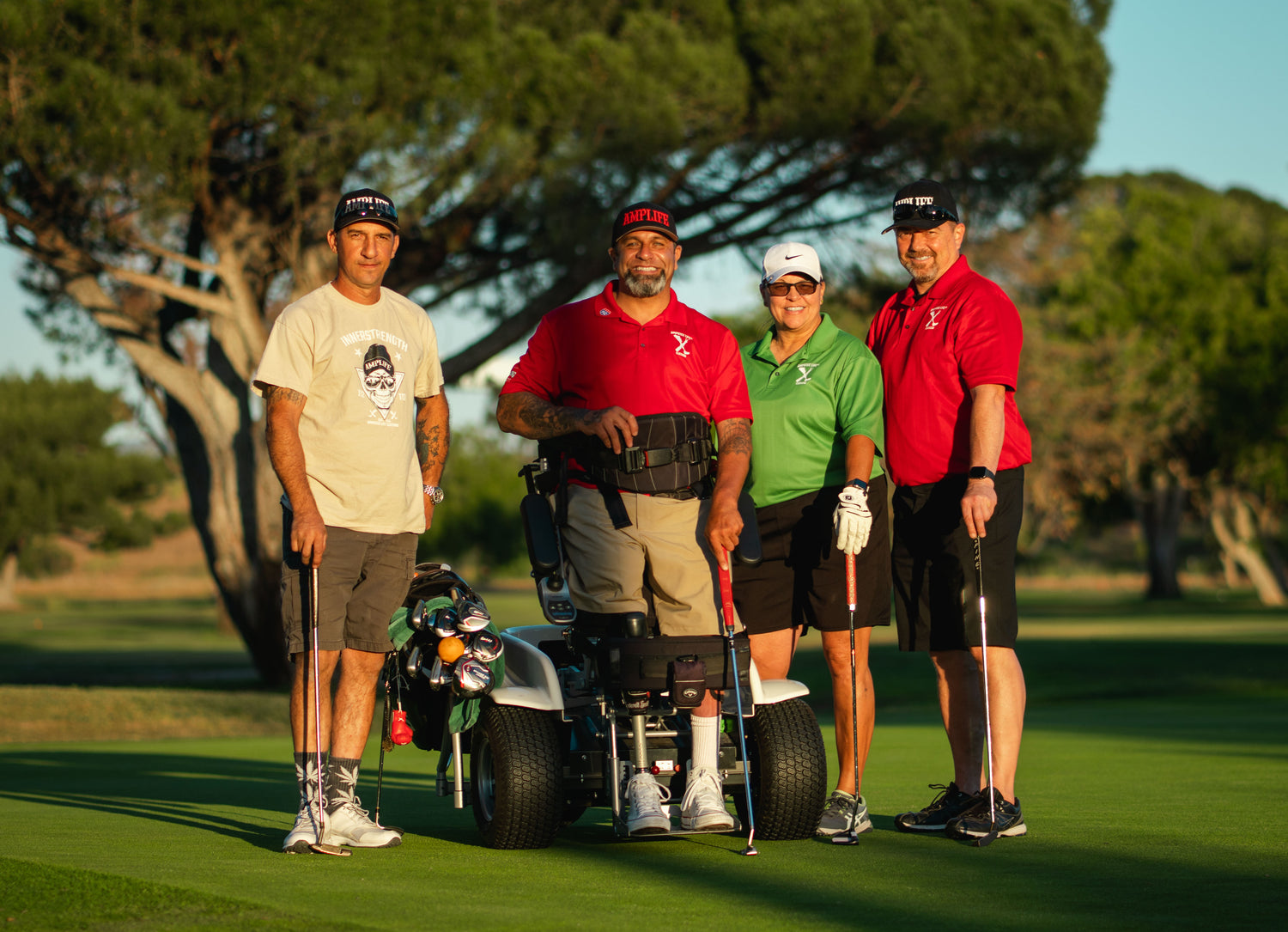 Group photo of Amplife® Foundation & Amplife® Founder Abdul Nevarez with three Amplife® Supporters on the golf course green