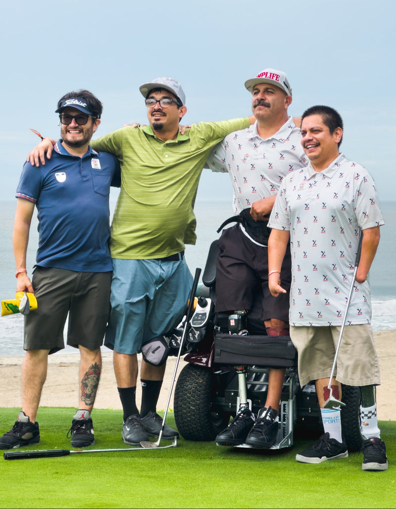 Group photo of Amplife® Foundation & Amplife® Founder Abdul Nevarez with Team Amplife® Ambassador Oscar Loreto, Jr. and two Amplife® Supporters on a coastal golf course green