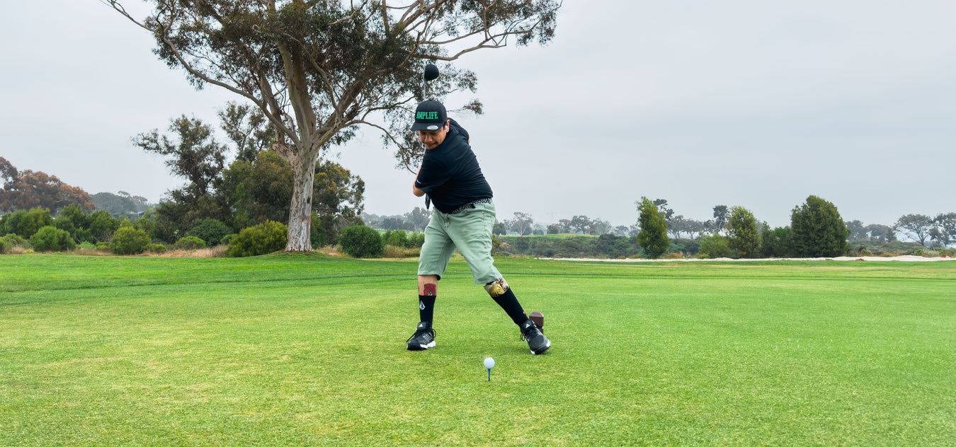 Team Amplife® Ambassador Oscar Loreto, Jr. the fairway at Torrey Pines Golf Course while wearing the Amplife® Curved Bill Snapback