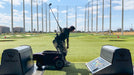 Amplife Founder Abdul Nevarez at TopGolf on an adaptive golf cart.