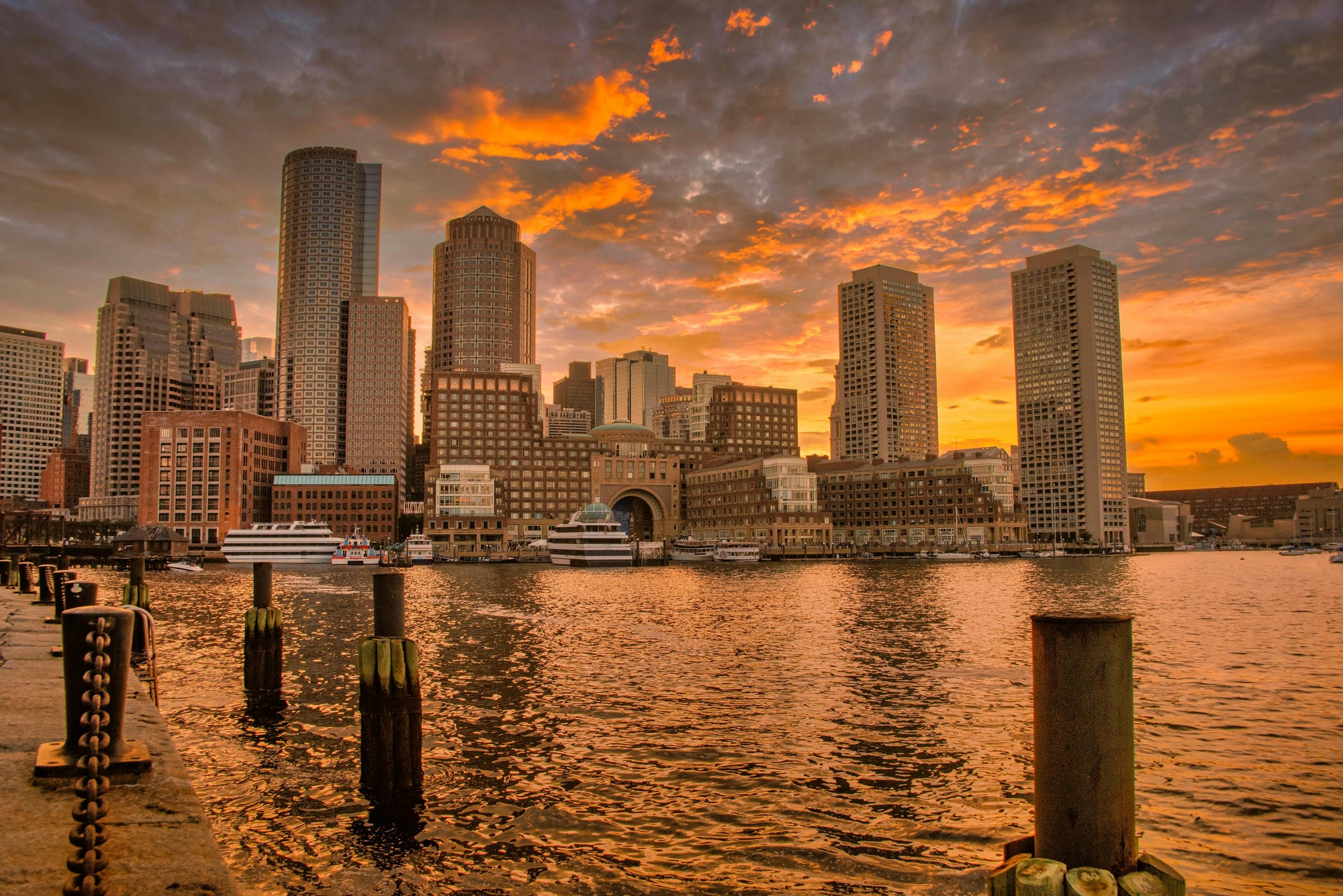 Boston skyline sunset over water