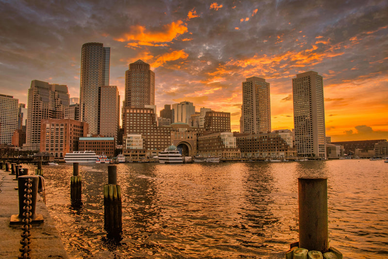 Boston skyline sunset over water