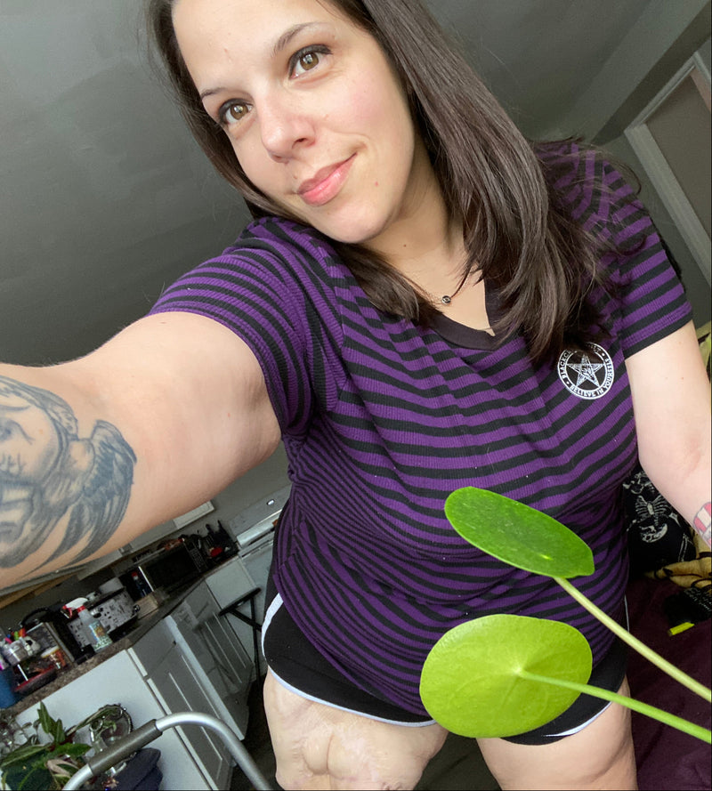 Selfie of Team Amplife® Ambassador Ashley Schrute holding a plant