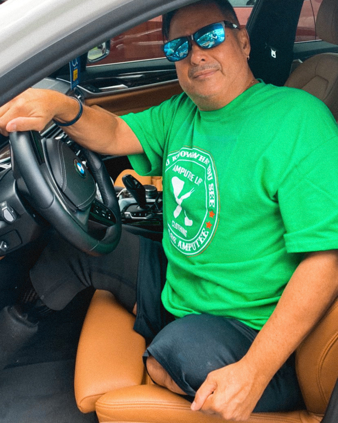 Team Amplife Ambassadors Tomás De La Mora standing next to his car and Bert Chirino in the driver seat of his car.