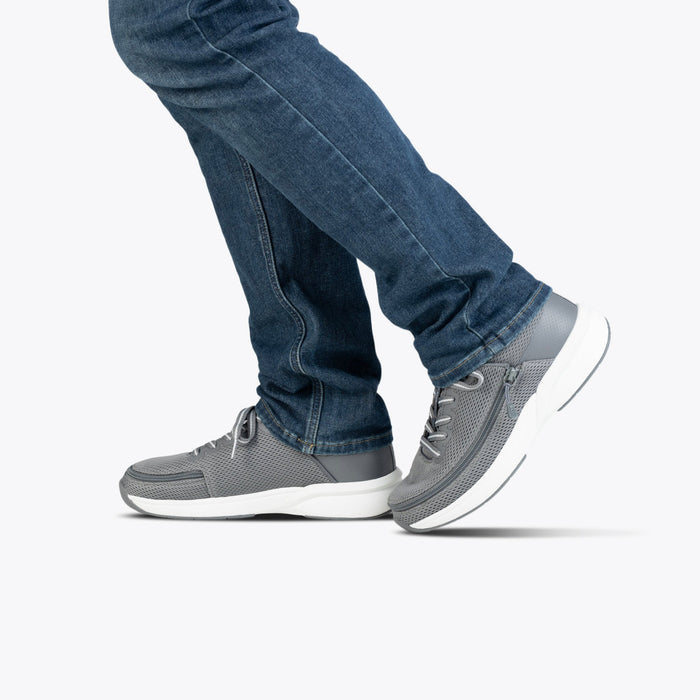 Men's Charcoal BILLY Limitless being modeled with blue jeans on a white background
