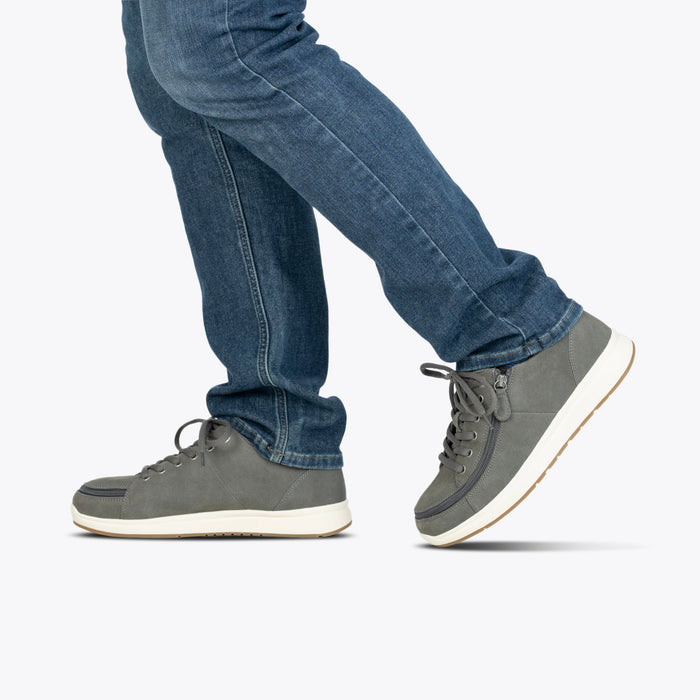 Men's Charcoal Suede BILLY Comfort Plush being modeled with blue jeans on a white background