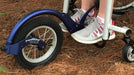 Detail of a FreeWheel Wheelchair Attachment Blue on a wheelchair outdoors.
