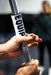 Detail of Equip Products Barbell Markers for Visually Impaired in use on a barbell with an athlete holding on the barbell next to the marker.