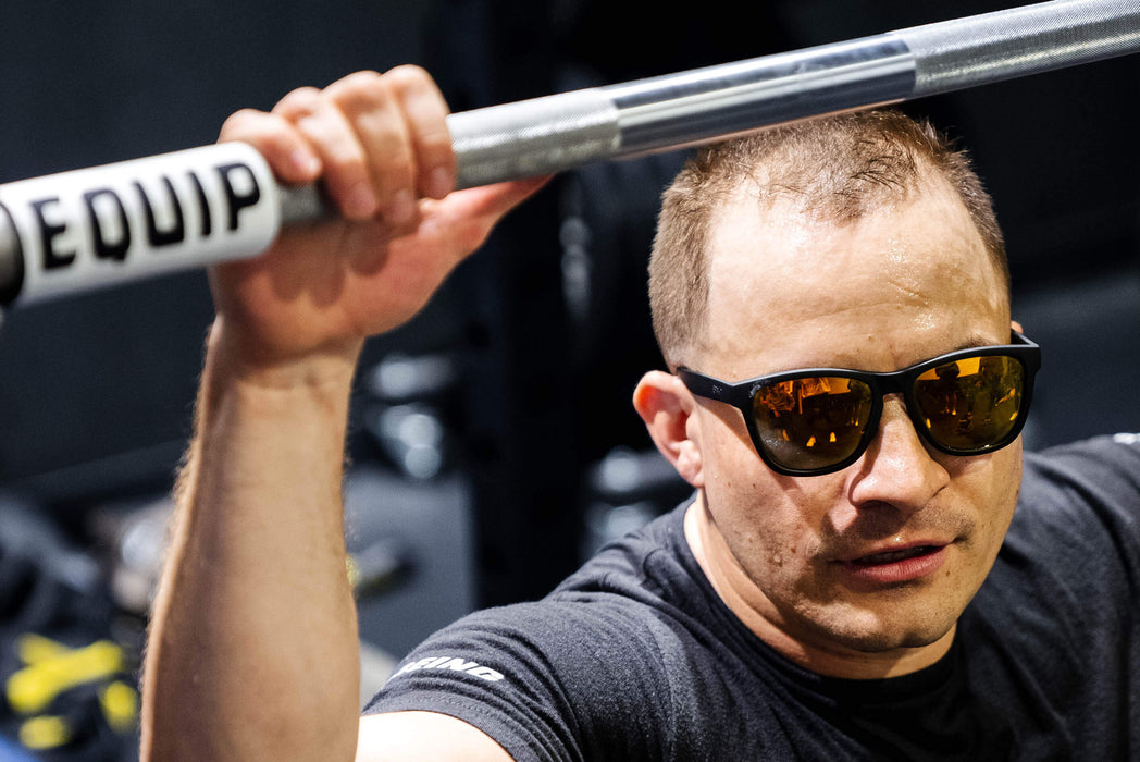 Equip Products Barbell Markers for Visually Impaired in use by an athlete with visual impairment getting ready for the lift.