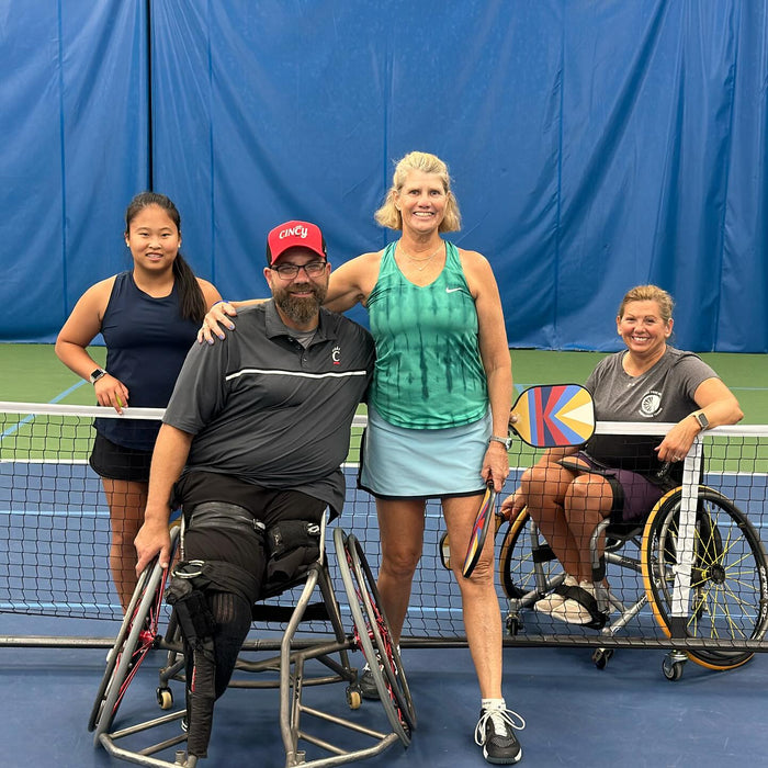 Portrait of two Cincinnati Tennis Foundation Championship wheelchair and para-standing competitors on the court.