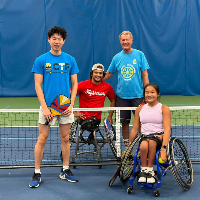 Portrait of two Cincinnati Tennis Foundation Championship wheelchair and para-standing competitors on the court with their pickleball paddles with their pickleball paddles.