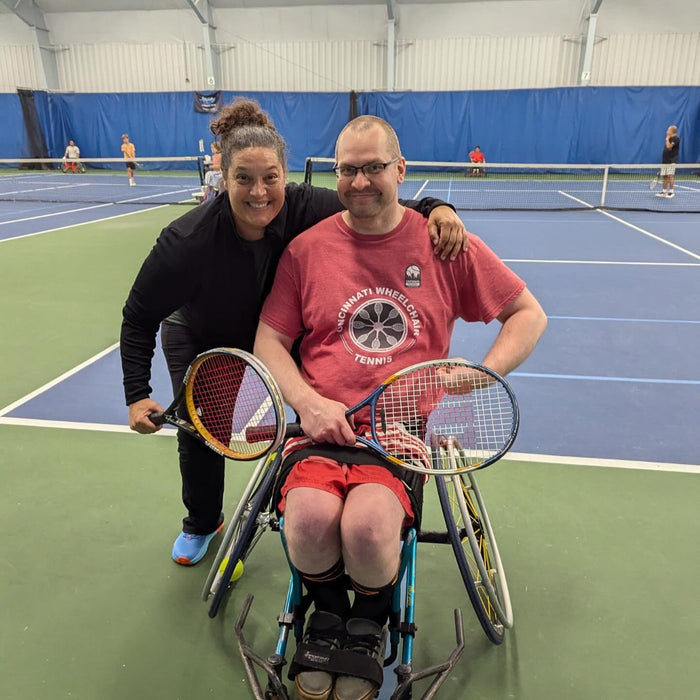 Portrait of Cincinnati Tennis Foundation Championship wheelchair and para-standing competitors with their tennis racquets.