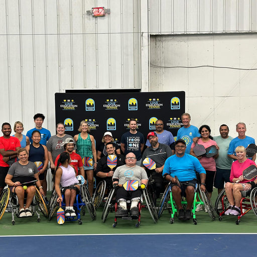 Group of Cincinnati Tennis Foundation Championship competitors in front of a banner of Cincinnati Tennis Foundation logos.