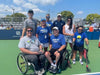 Group of Cincinnati Tennis Foundation coaches and players on a tennis court.