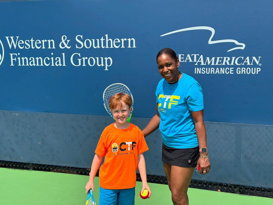 Woman and child from Cincinnati Tennis Foundation on a tennis court.