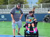 Father and child from Cincinnati Tennis Foundation on a tennis court.