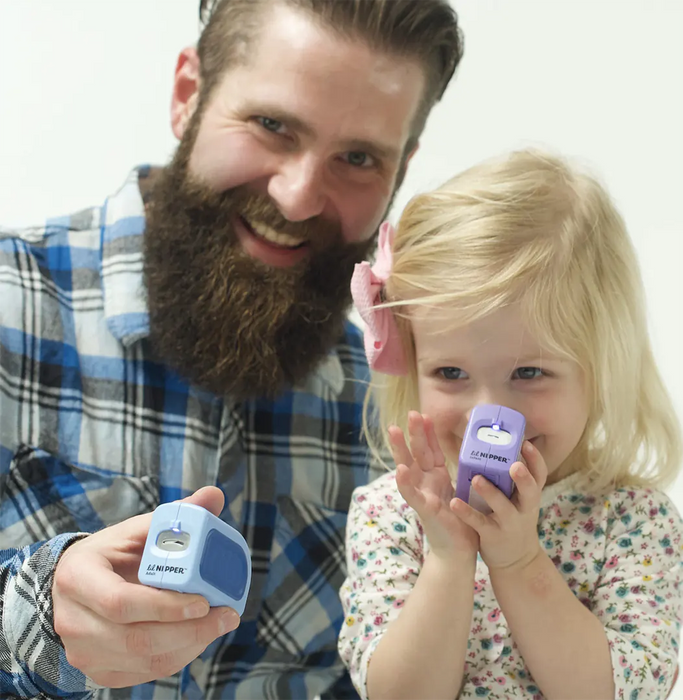 Parent and toddler using Lil Nipper nail clipper by ClipDifferent
