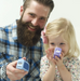 Parent and toddler using Lil Nipper nail clipper by ClipDifferent