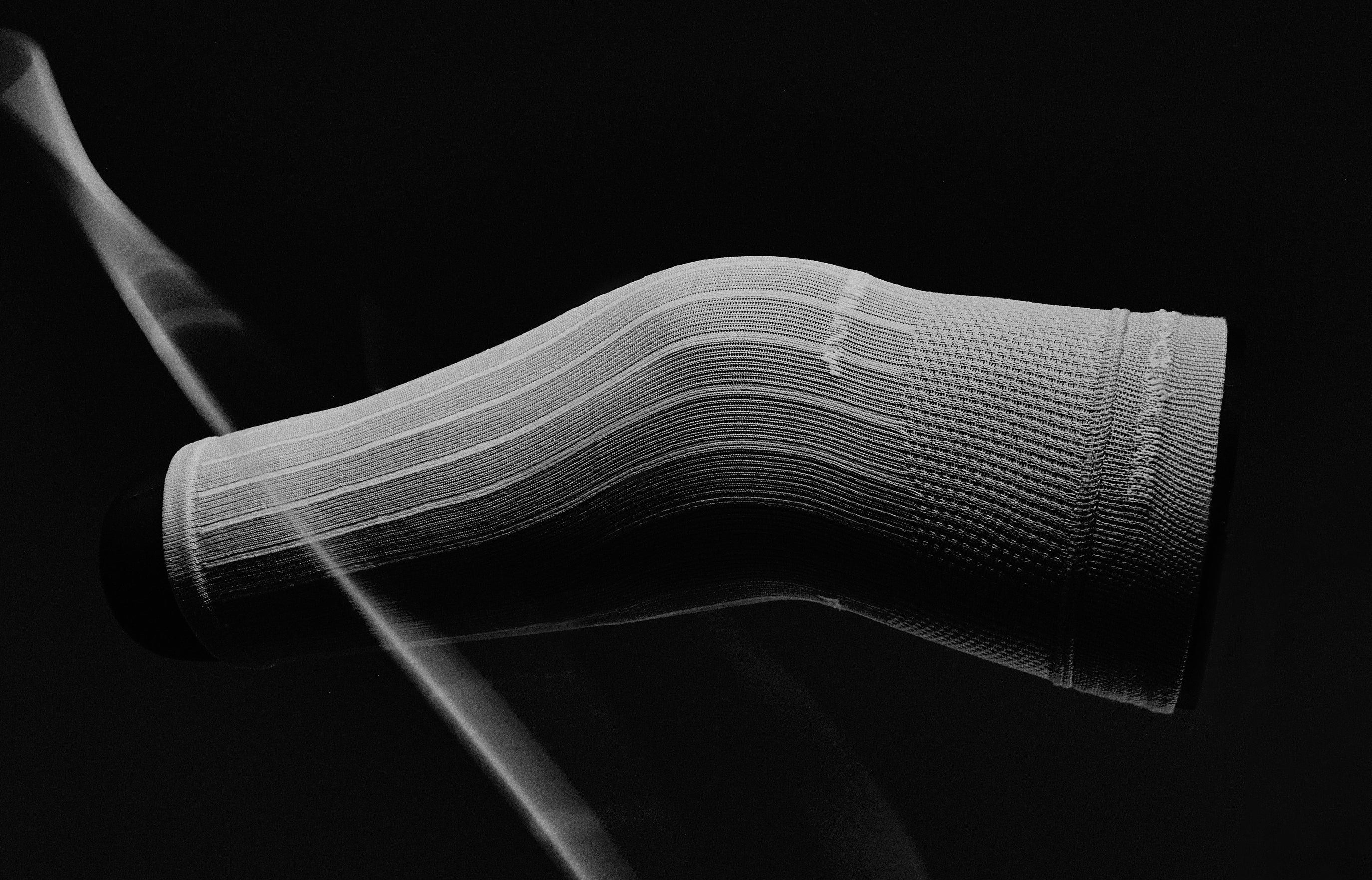Ethnocare Underlay on a black background with white streak across the left edge