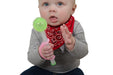 Baby holding a toy with  a pink EaZyHold Grip Aid on a white background