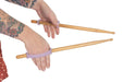 Drumsticks with a lavendar EaZyHold Grip Aids held by a hand on a white background