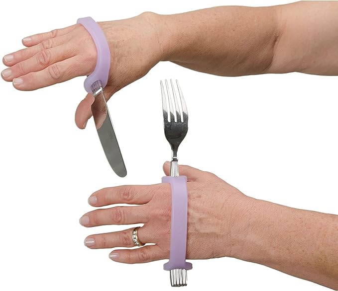 Hands wearing EaZyHold Grip Aid with knife and fork on a white background