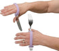 Hands wearing EaZyHold Grip Aid with knife and fork on a white background