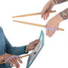 Two pairs of hands holding drumsticks & painting with EaZyHold Grip Aid on a white background