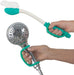 Handheld shower head with a flexible hose held by EaZyHold Grip Aid on a white background