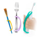 EaZyHold Grip Aids attached to a paintbrush, fork, and toothbrush on a white background