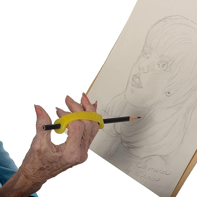Hand holding a pencil with a EaZyHold Grip Aid, drawing a portrait on paper.