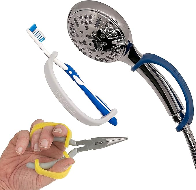 Handheld shower head, toothbrush, and pliers held by a hand with an EaZyHold Grip Aid on a white background