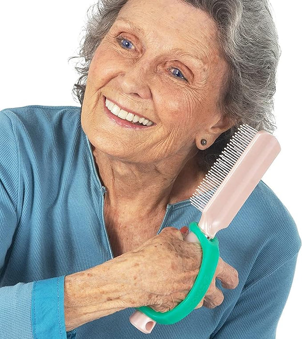 Woman holding a hair comb with a EaZyHold Grip Aid on a white background