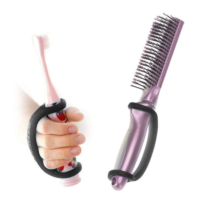 Purple comb and hand holding a pink toothbrush with a black EaZyHold Grid Aid on a white background